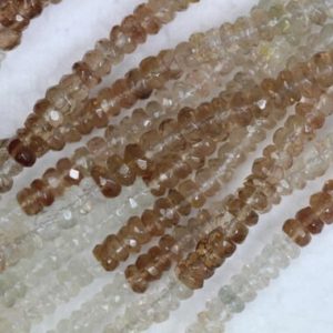 Shop Topaz Faceted Beads! Natural, 14 inch long strand faceted IMPERIAL TOPAZ rondelle briolette beads, 1×3–3×4 mm app, topaz gemstone, fancy beads, wholesale | Natural genuine faceted Topaz beads for beading and jewelry making.  #jewelry #beads #beadedjewelry #diyjewelry #jewelrymaking #beadstore #beading #affiliate #ad