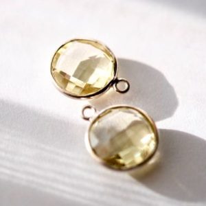 Shop Topaz Shapes! Lemon Topaz coin Connector in silver bezel 2 pieces | Natural genuine stones & crystals in various shapes & sizes. Buy raw cut, tumbled, or polished gemstones for making jewelry or crystal healing energy vibration raising reiki stones. #crystals #gemstones #crystalhealing #crystalsandgemstones #energyhealing #affiliate #ad