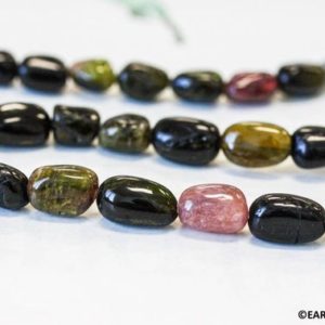 Shop Tourmaline Chip & Nugget Beads! M/ Tourmaline 8x10mm Tumbled Nugget beads 15.5" long Natural Multi Tourmaline Nugget Size varies For DIY Jewelry Making. | Natural genuine chip Tourmaline beads for beading and jewelry making.  #jewelry #beads #beadedjewelry #diyjewelry #jewelrymaking #beadstore #beading #affiliate #ad