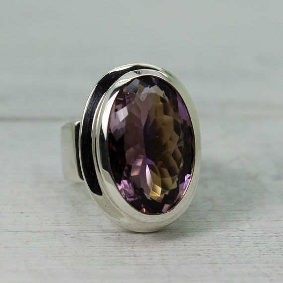 Magnifique Ametrine Ring ... Amethyst And Citrine Stone Called Ametrine Oval Shape Cut Stone With A Flat Top Set On 925 Sterling Silver