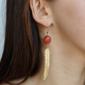 Shop Carnelian Earrings! Carnelian gold earrings, gold feather earrings, long earrings, boho earrings dangle, festival jewelry, orange stone earrings | Natural genuine Carnelian earrings. Buy crystal jewelry, handmade handcrafted artisan jewelry for women.  Unique handmade gift ideas. #jewelry #beadedearrings #beadedjewelry #gift #shopping #handmadejewelry #fashion #style #product #earrings #affiliate #ad