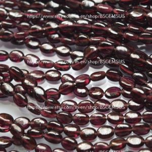 Shop Garnet Bead Shapes! 18 Inches Strand,Natural Rhodolite GARNET Smooth Oval Beads. Size 7-7.5mm | Natural genuine other-shape Garnet beads for beading and jewelry making.  #jewelry #beads #beadedjewelry #diyjewelry #jewelrymaking #beadstore #beading #affiliate #ad