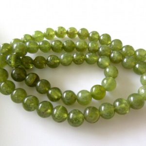 Shop Garnet Round Beads! 5 Strands Wholesale Vessonite Green Garnet Smooth Round Beads, 6mm Each, 13 Inch Strand, GDS246 | Natural genuine round Garnet beads for beading and jewelry making.  #jewelry #beads #beadedjewelry #diyjewelry #jewelrymaking #beadstore #beading #affiliate #ad
