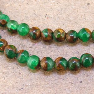 Shop Jade Round Beads! One Full Strand — Charm Round Zambian Gold Green Jade Stone Gemstone Beads— 6mm —-about 65Pieces—- 15.5" in length | Natural genuine round Jade beads for beading and jewelry making.  #jewelry #beads #beadedjewelry #diyjewelry #jewelrymaking #beadstore #beading #affiliate #ad