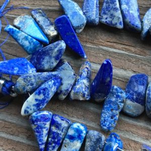 Shop Lapis Lazuli Chip & Nugget Beads! Lapis Lazuli gemstone beads shards | Natural genuine chip Lapis Lazuli beads for beading and jewelry making.  #jewelry #beads #beadedjewelry #diyjewelry #jewelrymaking #beadstore #beading #affiliate #ad