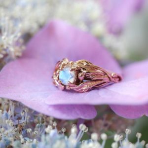 Shop Moonstone Engagement Rings! Rose gold moonstone engagement ring, leaves ring, unique proposal ring, leaves ring for woman, nature inspired ring, rainbow moonstone ring | Natural genuine Moonstone rings, simple unique alternative gemstone engagement rings. #rings #jewelry #bridal #wedding #jewelryaccessories #engagementrings #weddingideas #affiliate #ad