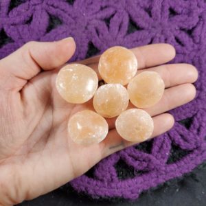 Shop Tumbled Selenite Crystals & Pocket Stones! 6 Peach Selenite Tumbled Polished Crystal Orb Stones UFO Crystals Cylinders Unique orange gridding | Natural genuine stones & crystals in various shapes & sizes. Buy raw cut, tumbled, or polished gemstones for making jewelry or crystal healing energy vibration raising reiki stones. #crystals #gemstones #crystalhealing #crystalsandgemstones #energyhealing #affiliate #ad