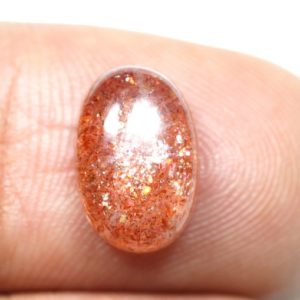 Shop Sunstone Cabochons! Red Sparkles Sunstone Cabochon Natural Sunstone Ring Size Gemstone 3.70 Carat 12×8 MM Orange Sunstone Oval Shape Gemstone | Natural genuine stones & crystals in various shapes & sizes. Buy raw cut, tumbled, or polished gemstones for making jewelry or crystal healing energy vibration raising reiki stones. #crystals #gemstones #crystalhealing #crystalsandgemstones #energyhealing #affiliate #ad