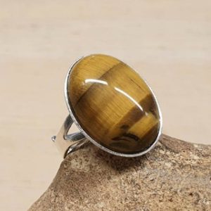 Shop Tiger Eye Rings! Tiger's eye ring. Brown Reiki jewelry. Capricorn jewelry. Women's Adjustable ring uk. 18x13mm stone. 925 sterling silver rings for women | Natural genuine Tiger Eye rings, simple unique handcrafted gemstone rings. #rings #jewelry #shopping #gift #handmade #fashion #style #affiliate #ad