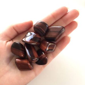 Red Tigers Eye Tumbled Stone 20-25mm | Natural genuine stones & crystals in various shapes & sizes. Buy raw cut, tumbled, or polished gemstones for making jewelry or crystal healing energy vibration raising reiki stones. #crystals #gemstones #crystalhealing #crystalsandgemstones #energyhealing #affiliate #ad