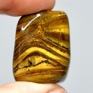 Shop Tumbled Tiger Eye Crystals & Pocket Stones! Tumbled Tiger Eye Stones | Natural genuine stones & crystals in various shapes & sizes. Buy raw cut, tumbled, or polished gemstones for making jewelry or crystal healing energy vibration raising reiki stones. #crystals #gemstones #crystalhealing #crystalsandgemstones #energyhealing #affiliate #ad