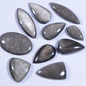 Shop Obsidian Cabochons! 10 Pcs Lot, Natural Silver Sheen Obsidian Gemstone, Rare Super Shiny Obsidian Cabochon, 97.75 Cts, Mix Shape Lot Silver Sheen Cabochon Stone | Natural genuine stones & crystals in various shapes & sizes. Buy raw cut, tumbled, or polished gemstones for making jewelry or crystal healing energy vibration raising reiki stones. #crystals #gemstones #crystalhealing #crystalsandgemstones #energyhealing #affiliate #ad
