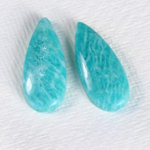 Shop Amazonite Cabochons! A pair of Russian Amazonite cabochons, 25 x 11mm, 23cts total weight | Natural genuine stones & crystals in various shapes & sizes. Buy raw cut, tumbled, or polished gemstones for making jewelry or crystal healing energy vibration raising reiki stones. #crystals #gemstones #crystalhealing #crystalsandgemstones #energyhealing #affiliate #ad