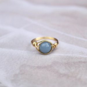 Shop Angelite Jewelry! Angelite ring, gold wire ring, gold ring, blue stone ring, gemstone ring, angelite wire ring, boho wire ring, wire wrapped ring, gold ring | Natural genuine Angelite jewelry. Buy crystal jewelry, handmade handcrafted artisan jewelry for women.  Unique handmade gift ideas. #jewelry #beadedjewelry #beadedjewelry #gift #shopping #handmadejewelry #fashion #style #product #jewelry #affiliate #ad