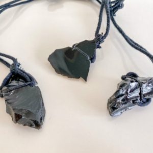 Shop Obsidian Necklaces! Black Obsidian Necklace, free form stone, Obsidian on black cord | Natural genuine Obsidian necklaces. Buy crystal jewelry, handmade handcrafted artisan jewelry for women.  Unique handmade gift ideas. #jewelry #beadednecklaces #beadedjewelry #gift #shopping #handmadejewelry #fashion #style #product #necklaces #affiliate #ad