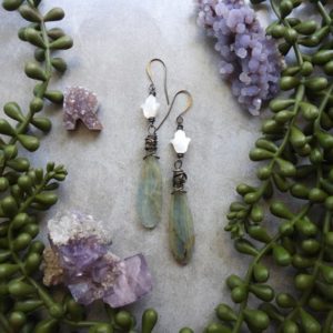 Shop Blue Calcite Jewelry! Blue Calcite & Mother of Pearl Hamsa Earrings – Blue Calcite Earrings – Gemstone Drop Earrings – Hamsa Hand Earrings – Crystal Earrings | Natural genuine Blue Calcite jewelry. Buy crystal jewelry, handmade handcrafted artisan jewelry for women.  Unique handmade gift ideas. #jewelry #beadedjewelry #beadedjewelry #gift #shopping #handmadejewelry #fashion #style #product #jewelry #affiliate #ad