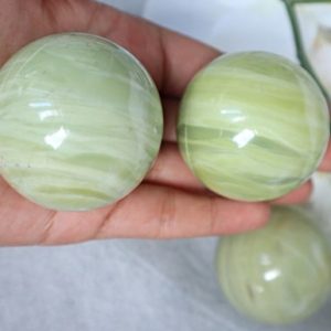 Shop Jade Shapes! Butter Jade Sphere 45mm, Green Jade Crystal Sphere for Abundance Lucky Stone | Natural genuine stones & crystals in various shapes & sizes. Buy raw cut, tumbled, or polished gemstones for making jewelry or crystal healing energy vibration raising reiki stones. #crystals #gemstones #crystalhealing #crystalsandgemstones #energyhealing #affiliate #ad