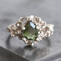 Gold Moldavite Ring, Unique Green Engagement Ring, Alternative Wedding Ring, Meteorite Crystal Ring | Natural genuine Gemstone jewelry. Buy handcrafted artisan wedding jewelry.  Unique handmade bridal jewelry gift ideas. #jewelry #beadedjewelry #gift #crystaljewelry #shopping #handmadejewelry #wedding #bridal #jewelry #affiliate #ad