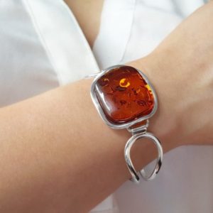Shop Amber Bracelets! Large Baltic Amber Bangle, Big Amber Bracelet, Silver and Amber Stone Bangle, Statement Cognac Amber Bangle, Amber Arm Cuff, Amber Bracelet | Natural genuine Amber bracelets. Buy crystal jewelry, handmade handcrafted artisan jewelry for women.  Unique handmade gift ideas. #jewelry #beadedbracelets #beadedjewelry #gift #shopping #handmadejewelry #fashion #style #product #bracelets #affiliate #ad
