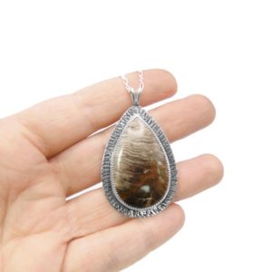 Shop Petrified Wood Jewelry! Large Petrified Wood Necklace in Sterling Silver – Fossil Jewelry – Pendant With Chain | Natural genuine Petrified Wood jewelry. Buy crystal jewelry, handmade handcrafted artisan jewelry for women.  Unique handmade gift ideas. #jewelry #beadedjewelry #beadedjewelry #gift #shopping #handmadejewelry #fashion #style #product #jewelry #affiliate #ad
