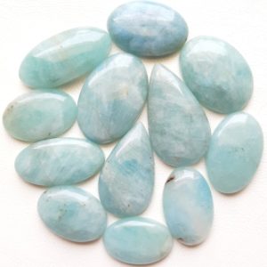 Shop Aquamarine Stones & Crystals! Natural Aquamarine Cabochon Wholesale Lot | AAA+  Natural Aquamarine By Weight With Different Shapes And Sizes Used For Jewelry Making | Natural genuine stones & crystals in various shapes & sizes. Buy raw cut, tumbled, or polished gemstones for making jewelry or crystal healing energy vibration raising reiki stones. #crystals #gemstones #crystalhealing #crystalsandgemstones #energyhealing #affiliate #ad