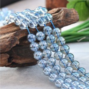Shop Angel Aura Quartz Beads! Natural Glossy Light Blue Angel Aura Quartz Gemstone Round Beads | Grade A | Sold by 15 inch Strand | Size 6mm 8mm 10mm | Natural genuine round Angel Aura Quartz beads for beading and jewelry making.  #jewelry #beads #beadedjewelry #diyjewelry #jewelrymaking #beadstore #beading #affiliate #ad