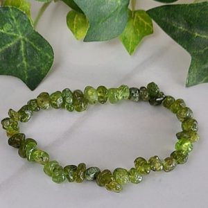 Shop Peridot Bracelets! Peridot chip bead bracelet stretch cord 7 inches | Natural genuine Peridot bracelets. Buy crystal jewelry, handmade handcrafted artisan jewelry for women.  Unique handmade gift ideas. #jewelry #beadedbracelets #beadedjewelry #gift #shopping #handmadejewelry #fashion #style #product #bracelets #affiliate #ad