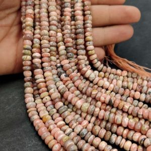 Shop Rhodochrosite Rondelle Beads! Pink Rhodochrosite Smooth Rondelle Beads AAA Natural Rhodochrosite Plain Rondelle Beads 16" Rhodochrosite Stone Rondelle 6-7mm | Natural genuine rondelle Rhodochrosite beads for beading and jewelry making.  #jewelry #beads #beadedjewelry #diyjewelry #jewelrymaking #beadstore #beading #affiliate #ad