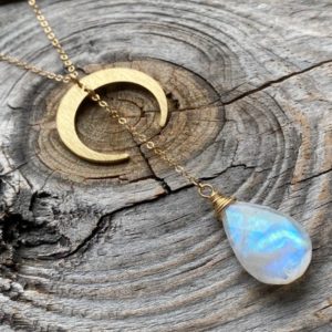 Shop Rainbow Moonstone Necklaces! Rainbow moonstone necklace Double horn necklace Moon phase necklace Gold lariat necklace Half moon necklace Y necklace Crescent moon pendant | Natural genuine Rainbow Moonstone necklaces. Buy crystal jewelry, handmade handcrafted artisan jewelry for women.  Unique handmade gift ideas. #jewelry #beadednecklaces #beadedjewelry #gift #shopping #handmadejewelry #fashion #style #product #necklaces #affiliate #ad