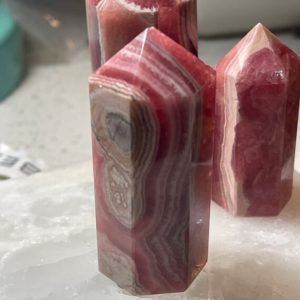 Shop Rhodochrosite Points & Wands! Rhodochrosite Point | Natural genuine stones & crystals in various shapes & sizes. Buy raw cut, tumbled, or polished gemstones for making jewelry or crystal healing energy vibration raising reiki stones. #crystals #gemstones #crystalhealing #crystalsandgemstones #energyhealing #affiliate #ad