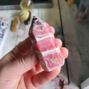 Shop Rhodochrosite Points & Wands! Rhodochrosite tower | Natural genuine stones & crystals in various shapes & sizes. Buy raw cut, tumbled, or polished gemstones for making jewelry or crystal healing energy vibration raising reiki stones. #crystals #gemstones #crystalhealing #crystalsandgemstones #energyhealing #affiliate #ad