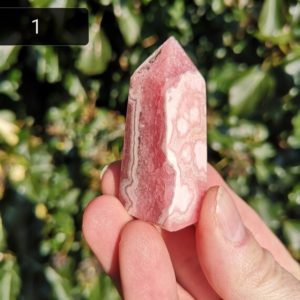 Shop Rhodochrosite Points & Wands! Rhodochrosite Tower – High Quality Rhodochrosite Point – Pink Crystal Rhodochrosite – Crystal for Self Love, Trauma Healing & Compassion | Natural genuine stones & crystals in various shapes & sizes. Buy raw cut, tumbled, or polished gemstones for making jewelry or crystal healing energy vibration raising reiki stones. #crystals #gemstones #crystalhealing #crystalsandgemstones #energyhealing #affiliate #ad