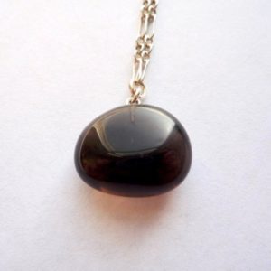 Shop Apache Tears Necklaces! Small obsidian nugget necklace with a solid sterling silver chain, Apache tears pendant | Natural genuine Apache Tears necklaces. Buy crystal jewelry, handmade handcrafted artisan jewelry for women.  Unique handmade gift ideas. #jewelry #beadednecklaces #beadedjewelry #gift #shopping #handmadejewelry #fashion #style #product #necklaces #affiliate #ad