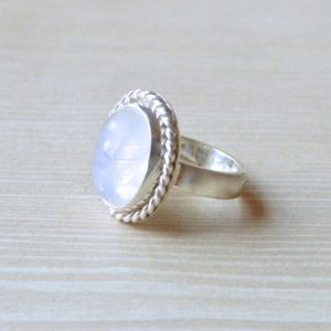 Shop Rainbow Moonstone Rings! Twisted Oval Rainbow Moonstone Ring // Moonstone Jewelry // Sterling Silver // Village Silversmith | Natural genuine Rainbow Moonstone rings, simple unique handcrafted gemstone rings. #rings #jewelry #shopping #gift #handmade #fashion #style #affiliate #ad