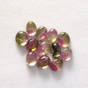 Shop Tourmaline Cabochons! 4.75 Carat Natural Bi-Colour Tourmaline Cabochon 4×5 mm Oval Good Quality Loose Gemstone for Jewellery Making at Wholesale Price | Natural genuine stones & crystals in various shapes & sizes. Buy raw cut, tumbled, or polished gemstones for making jewelry or crystal healing energy vibration raising reiki stones. #crystals #gemstones #crystalhealing #crystalsandgemstones #energyhealing #affiliate #ad