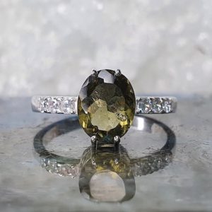 Shop Moldavite Rings! Moldavite Standing in the Light ring with 7×9mm faceted Moldavite and cubic zirconia | Genuine Moldavite Ring | Certified Moldavite Ring | Natural genuine Moldavite rings, simple unique handcrafted gemstone rings. #rings #jewelry #shopping #gift #handmade #fashion #style #affiliate #ad
