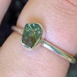 Rough Genuine Moldavite Sterling Silver Ring, Outer Space Rock, Stackable Moldavite Ring, Heart Chakra, Green Moldavite, Meteor, Unique | Natural genuine Array jewelry. Buy crystal jewelry, handmade handcrafted artisan jewelry for women.  Unique handmade gift ideas. #jewelry #beadedjewelry #beadedjewelry #gift #shopping #handmadejewelry #fashion #style #product #jewelry #affiliate #ad