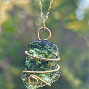 Shop Moldavite Necklaces! Solid 14k Gold Wire Wrapped Moldavite Necklace with 14k Gold Chain | Natural genuine Moldavite necklaces. Buy crystal jewelry, handmade handcrafted artisan jewelry for women.  Unique handmade gift ideas. #jewelry #beadednecklaces #beadedjewelry #gift #shopping #handmadejewelry #fashion #style #product #necklaces #affiliate #ad