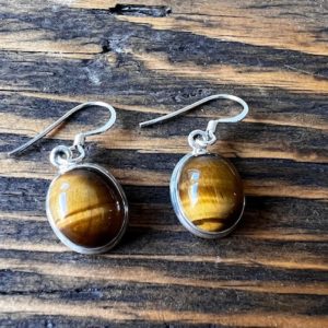 Shop Tiger Eye Earrings! Tiger eye sterling silver earrings , oval Tiger eye earrings , Brown earrings, healing stone earrings, gift for her | Natural genuine Tiger Eye earrings. Buy crystal jewelry, handmade handcrafted artisan jewelry for women.  Unique handmade gift ideas. #jewelry #beadedearrings #beadedjewelry #gift #shopping #handmadejewelry #fashion #style #product #earrings #affiliate #ad