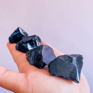 Shop Raw & Rough Obsidian Stones! Black Obsidian Raw Natural Crystals / Blocks Negativity / Absorbs Tension & Stress / Discourages Drama / Brings Strength And Courage | Natural genuine stones & crystals in various shapes & sizes. Buy raw cut, tumbled, or polished gemstones for making jewelry or crystal healing energy vibration raising reiki stones. #crystals #gemstones #crystalhealing #crystalsandgemstones #energyhealing #affiliate #ad