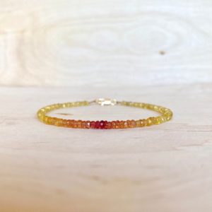 Bracelet precious stones gradient sapphires red oranges and yellows, artisanal jewel in natural stones for women | Natural genuine Yellow Sapphire bracelets. Buy crystal jewelry, handmade handcrafted artisan jewelry for women.  Unique handmade gift ideas. #jewelry #beadedbracelets #beadedjewelry #gift #shopping #handmadejewelry #fashion #style #product #bracelets #affiliate #ad