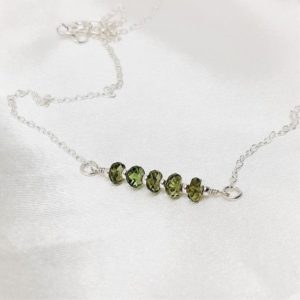 Shop Moldavite Necklaces! Genuine Moldavite Necklace, Czech Moldavite crystal necklace on a sterling silver chain, dainty bar necklace, rare high vibration stone gift | Natural genuine Moldavite necklaces. Buy crystal jewelry, handmade handcrafted artisan jewelry for women.  Unique handmade gift ideas. #jewelry #beadednecklaces #beadedjewelry #gift #shopping #handmadejewelry #fashion #style #product #necklaces #affiliate #ad