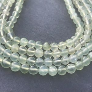 Shop Prehnite Round Beads! Prehnite 5.5mm smooth round beads -14 inches / 35.6cm long string – full string – Prehnite round beads . | Natural genuine round Prehnite beads for beading and jewelry making.  #jewelry #beads #beadedjewelry #diyjewelry #jewelrymaking #beadstore #beading #affiliate #ad