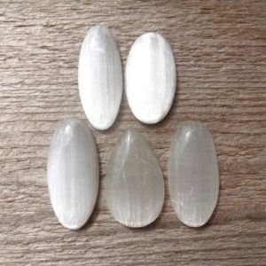 Shop Selenite Cabochons! White Selenite cabochon, white oval gemstone cabochon, natural white stone | Natural genuine stones & crystals in various shapes & sizes. Buy raw cut, tumbled, or polished gemstones for making jewelry or crystal healing energy vibration raising reiki stones. #crystals #gemstones #crystalhealing #crystalsandgemstones #energyhealing #affiliate #ad