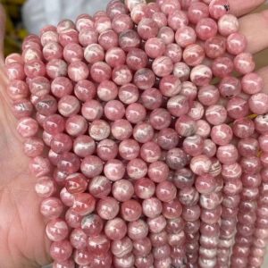 Shop Rhodochrosite Round Beads! 1 Full Strand 15.5" Loose Round Stone Smooth 5A Genuine Grade Real Natural Argentina Rhodochrosite Gemstone Beads for DIY Jewelry Making | Natural genuine round Rhodochrosite beads for beading and jewelry making.  #jewelry #beads #beadedjewelry #diyjewelry #jewelrymaking #beadstore #beading #affiliate #ad