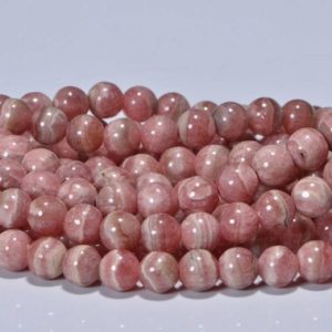 Shop Rhodochrosite Round Beads! 7mm Rhodochrosite Round beads Smooth pink stone Gemstone Beads   4 inch strand | Natural genuine round Rhodochrosite beads for beading and jewelry making.  #jewelry #beads #beadedjewelry #diyjewelry #jewelrymaking #beadstore #beading #affiliate #ad