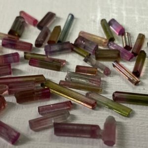 Shop Watermelon Tourmaline Stones & Crystals! Bicolor watermelon tourmaline raw crystal cut wire wrapping supply pcs 45 wt 18 carats small size 5x2mm-15x2mm watermelon tourmaline raw | Natural genuine stones & crystals in various shapes & sizes. Buy raw cut, tumbled, or polished gemstones for making jewelry or crystal healing energy vibration raising reiki stones. #crystals #gemstones #crystalhealing #crystalsandgemstones #energyhealing #affiliate #ad