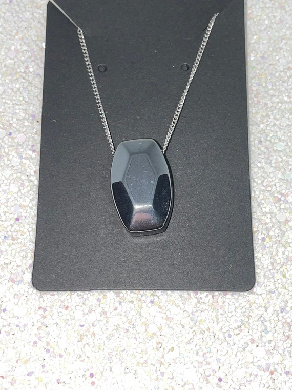 Hematite Pendant On Silver Colored Necklace