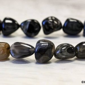 Shop Onyx Chip & Nugget Beads! L/ Black Onyx 16mm/ 14mm/ 12mm Tumbled Nugget beads 15.5" strand Size varies Natural Black Agate gemstone beads For jewelry making | Natural genuine chip Onyx beads for beading and jewelry making.  #jewelry #beads #beadedjewelry #diyjewelry #jewelrymaking #beadstore #beading #affiliate #ad
