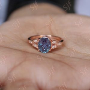 Shop Alexandrite Rings! Oval Alexandrite 14K Rose Gold Plated 925 Silver Engagement Wedding Anniversary Birthday Ring For Her Birthday Gift Color Changing | Natural genuine Alexandrite rings, simple unique alternative gemstone engagement rings. #rings #jewelry #bridal #wedding #jewelryaccessories #engagementrings #weddingideas #affiliate #ad